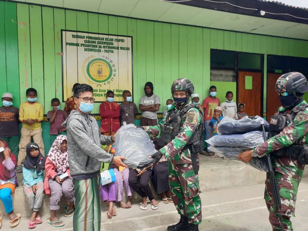 Sambut HUT Batalyon Ke-57, Satgas Yonif RK 751/VJS Menebar Senyum di Pegunungan Tengah Papua 1